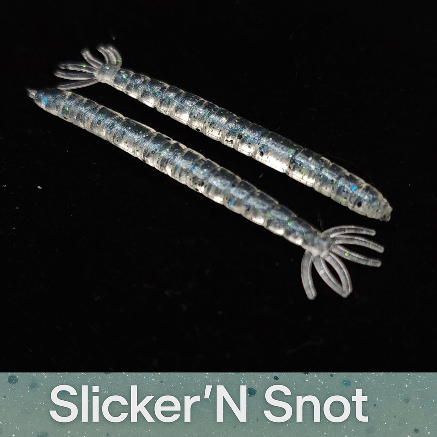 Two transparent blue fishing lures with a black background and 'Slicker'N Snot' branding.