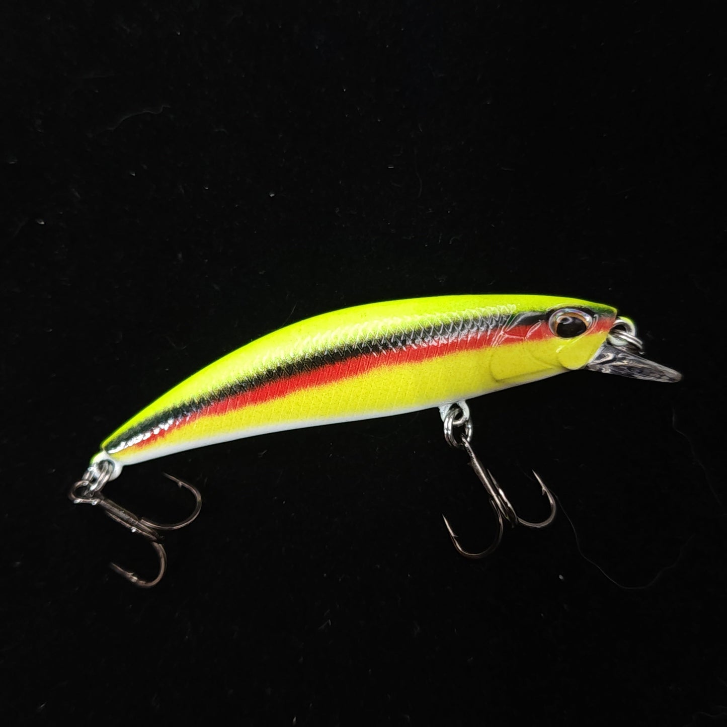 Colorful fishing lure on a black background