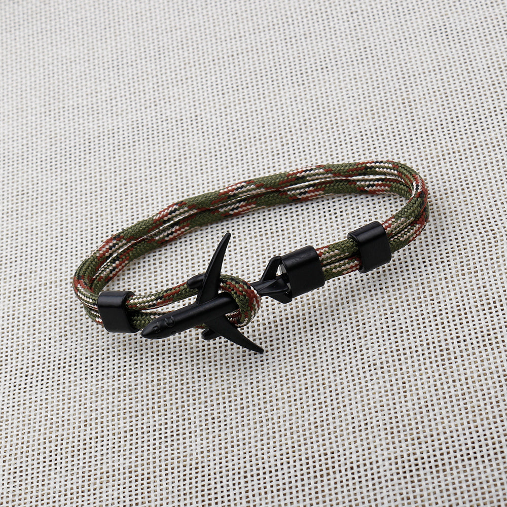 Bracelet with airplane clasp on a textured fabric background