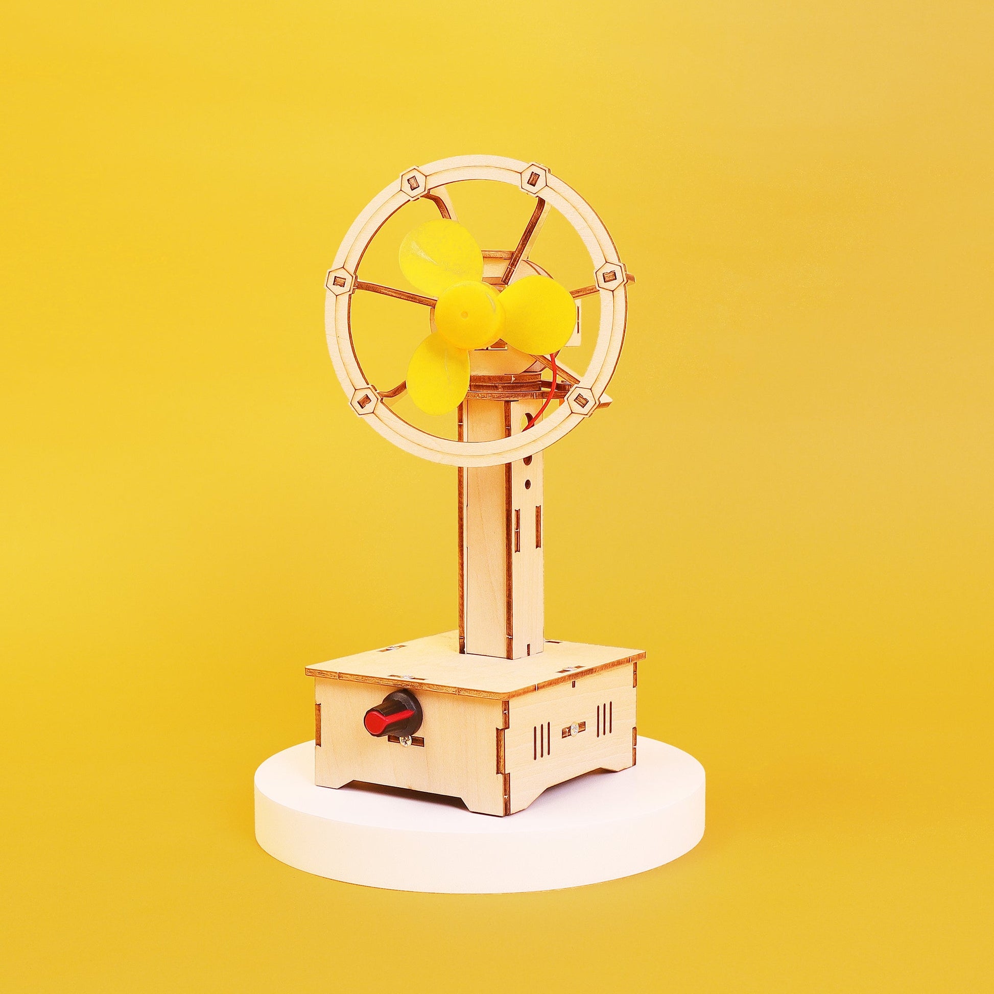DIY Kit Wooden model of a  Fan with a on a yellow background
