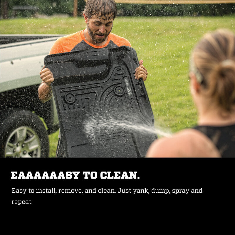 Person cleaning a black mat with water, with text about its ease of cleaning.