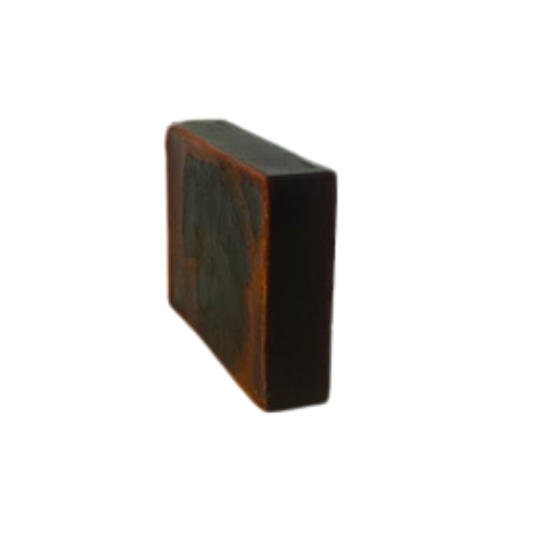 Rectangular turmeric soap bar on a white background