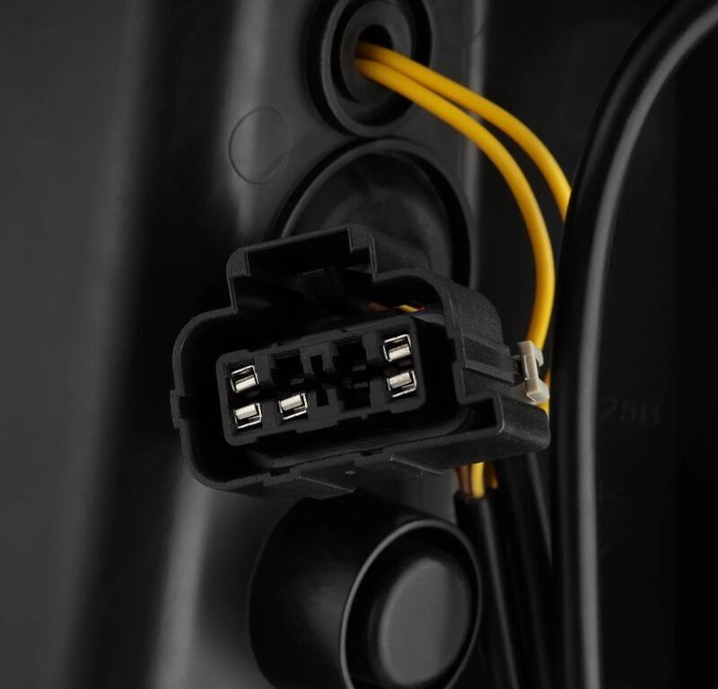 Close-up of a car wiring and connector on a dark background