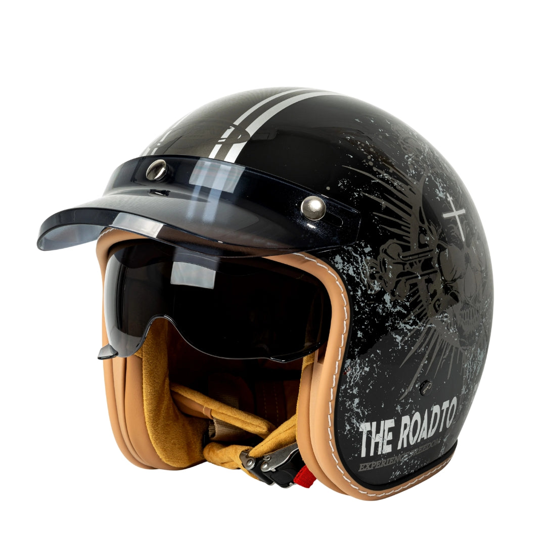 Black motorcycle helmet with visor and 'The Roadto' branding on a white background