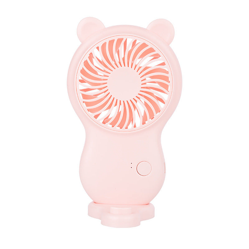 Pink handheld fan with bear ears on a white background