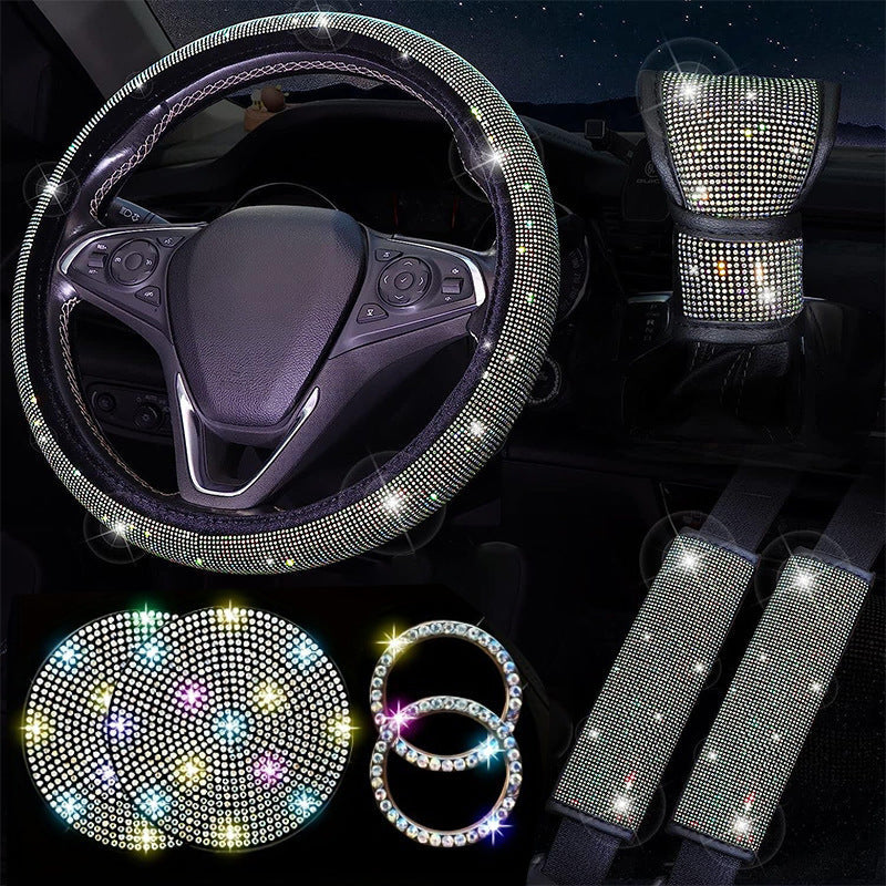 Car interior accessories with rhinestone embellishments including a steering wheel cover, seat covers, and coasters.