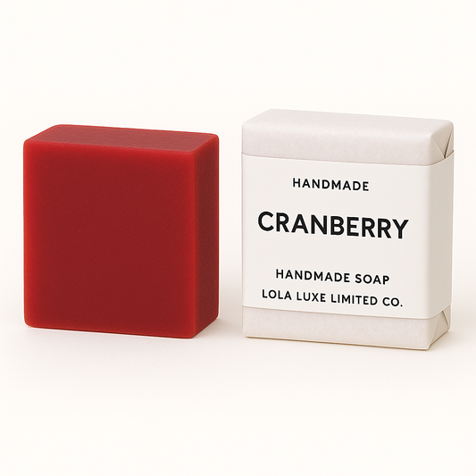 Cranberry Handmade Soap bar next to its white packaging with 'Cranberry' and brand name on a white background