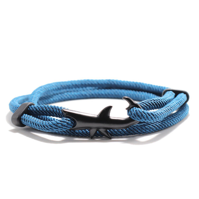Blue braided bracelet with a silver anchor clasp on a white background