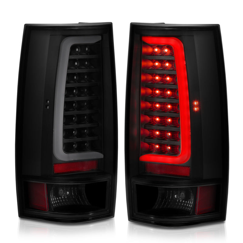 Pair of Chevy Tahoe car tail lights with red and clear lenses on a white background