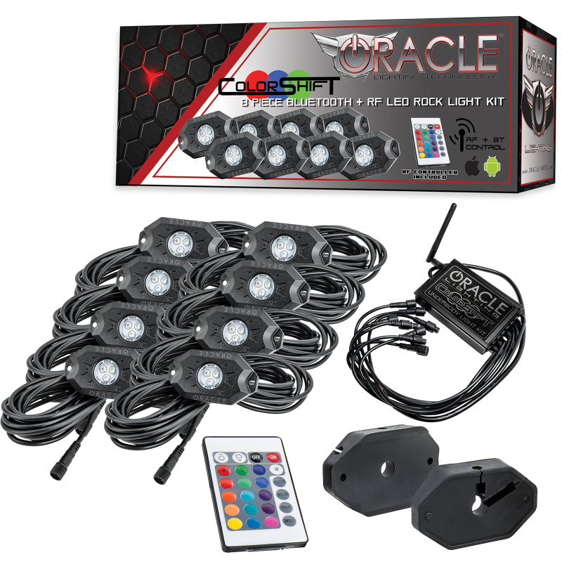 Oracle LED rock light kit with packaging, lights, remote control, and receiver on a white background