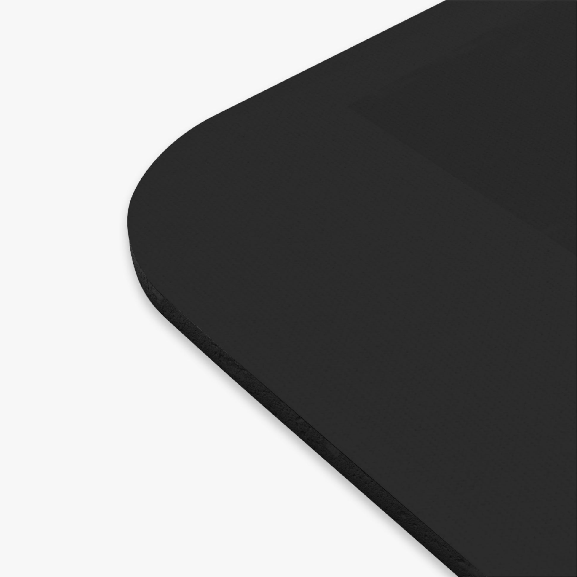 Black rectangular corner of mouse pad on a white background