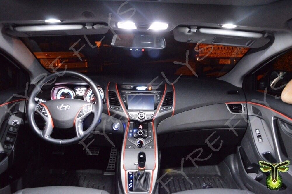 Car interior with illuminated dashboard and steering wheel
