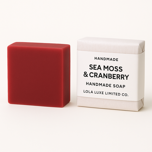 Sea Moss and Cranberry handmade soap bar next to its packaging on a white background
