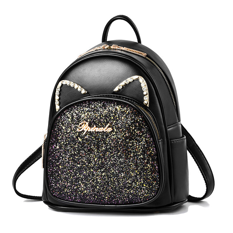 Black backpack with glittery front panel and cat ears on a white background