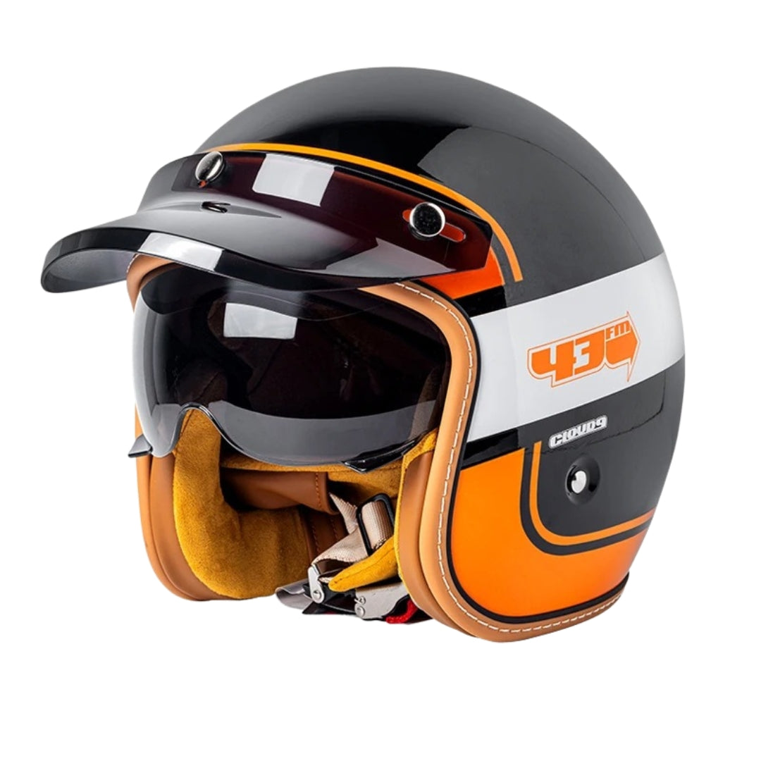 Motorcycle helmet with orange and black design on a white background
