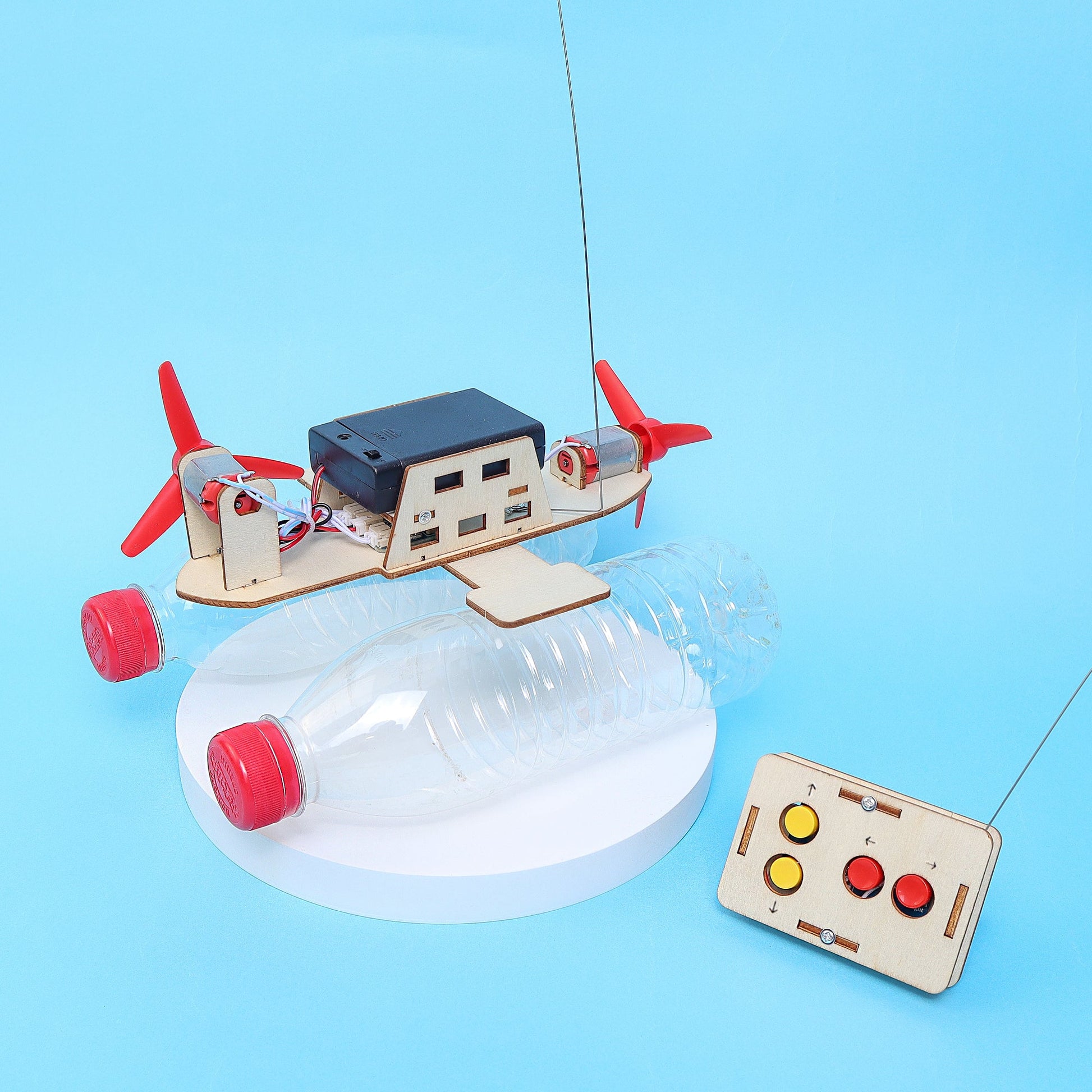 Toy boat with propellers and control panel on a blue background