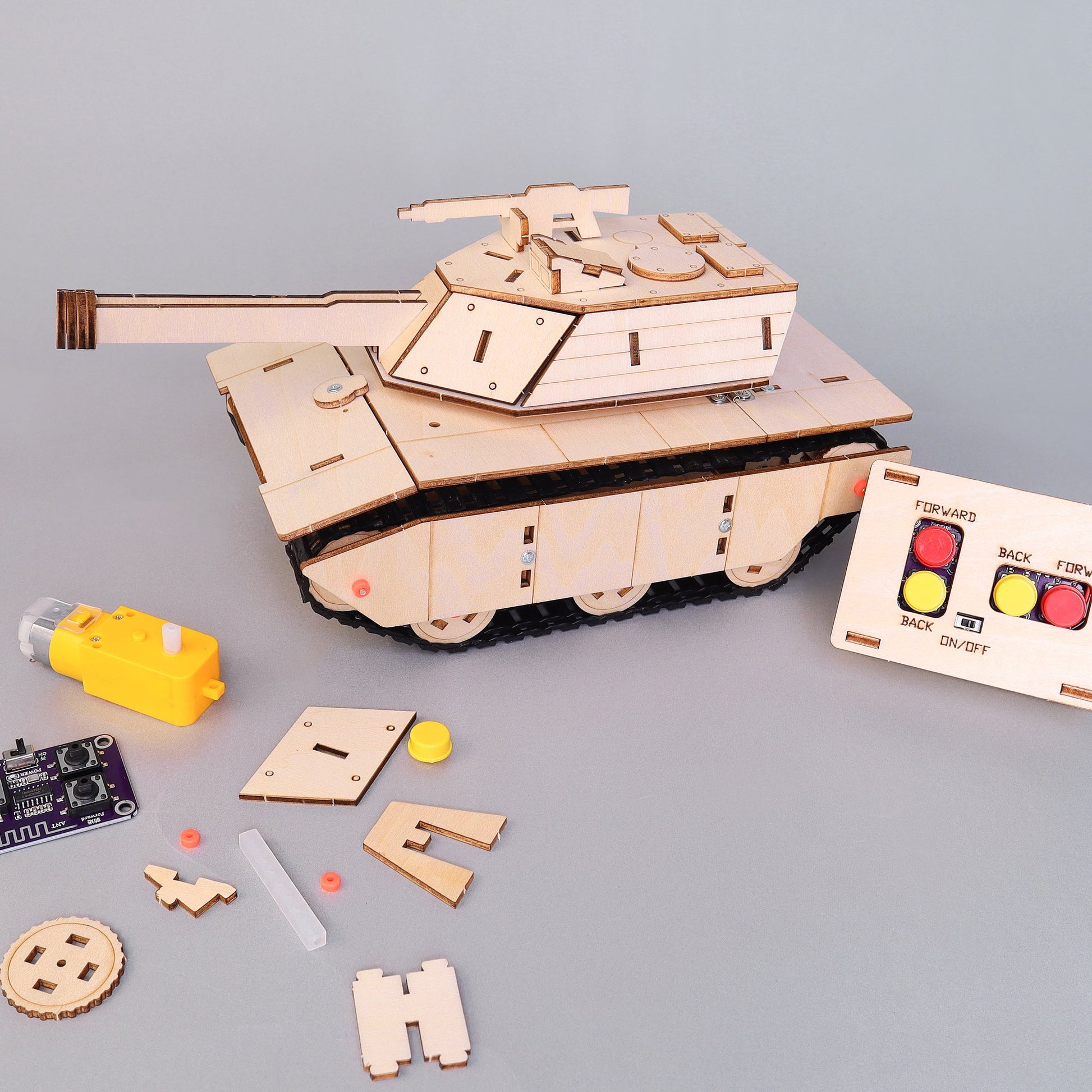 Wooden tank model kit with control panel on a gray background