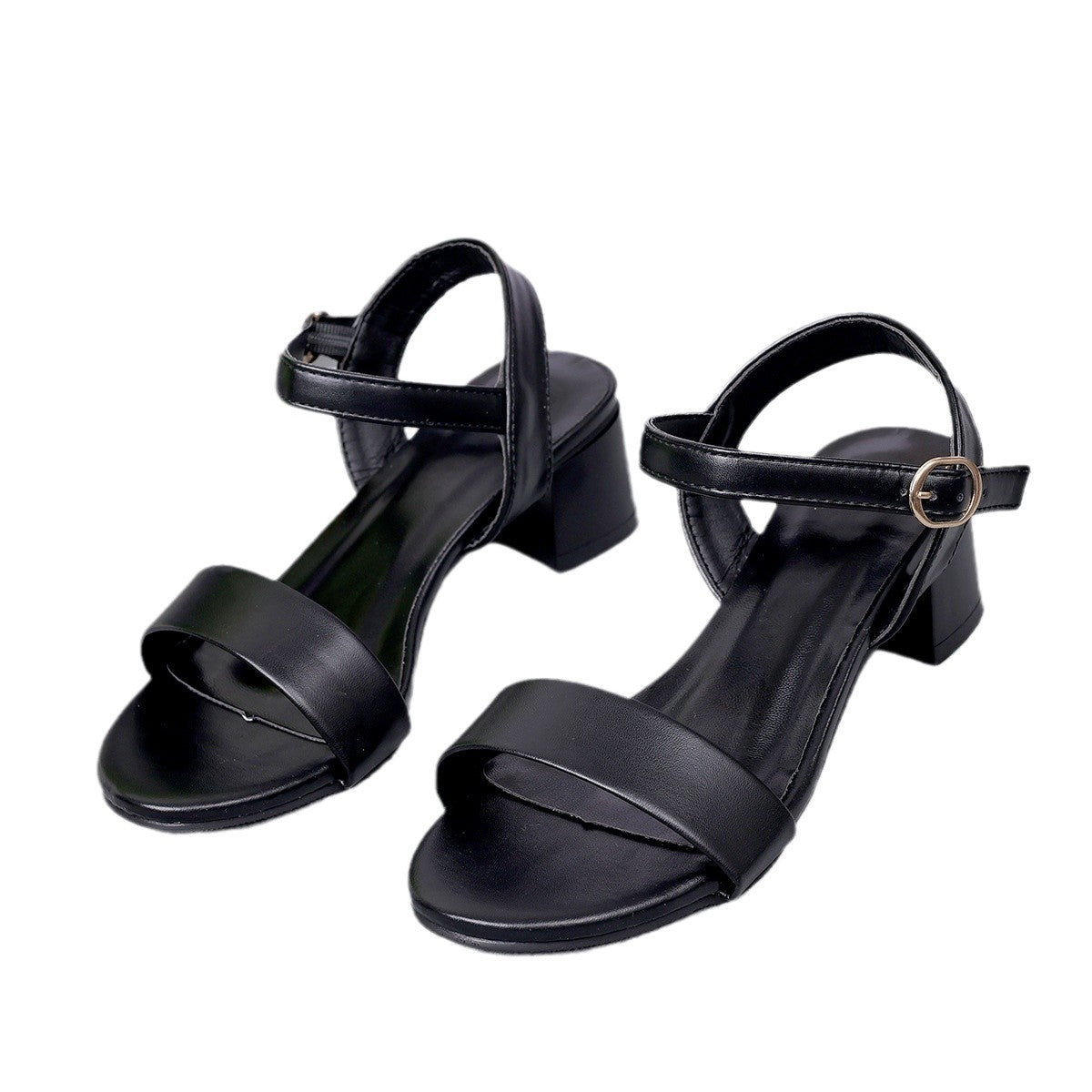 Black sandals with a block heel on a white background