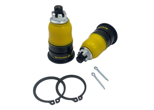 Two yellow shock absorbers with black accents and additional parts on a white background