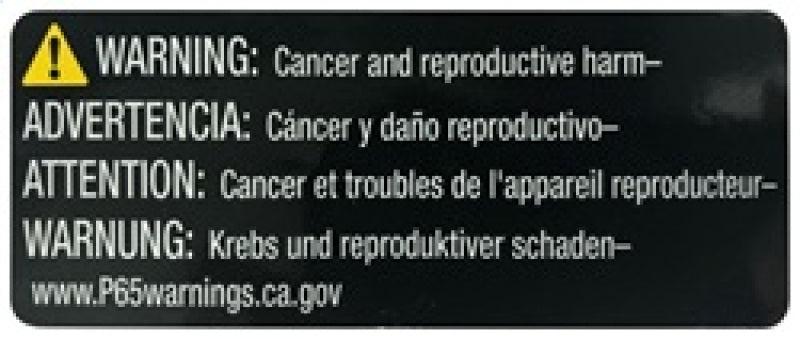 Multilingual warning label on a black background