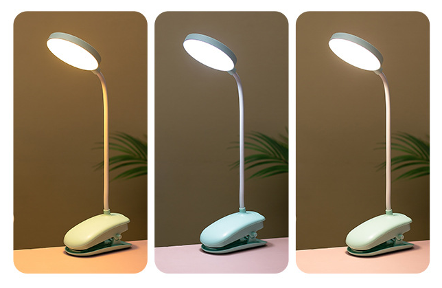 Three views of a desk lamp with a clip base on a plain background