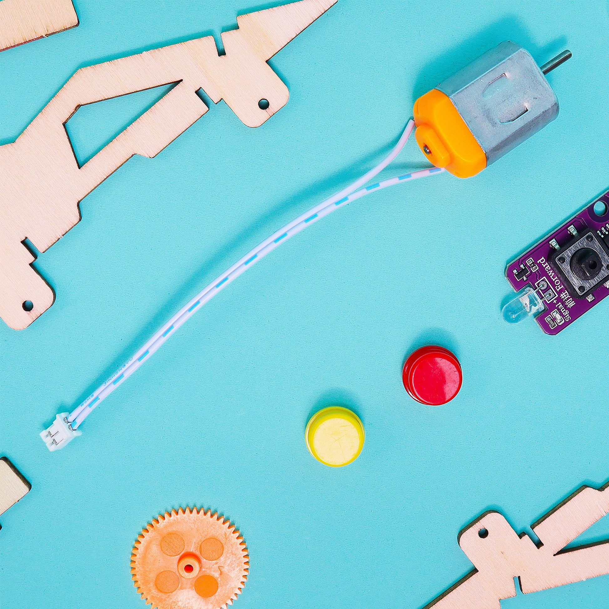 Educational robotics components on a blue background