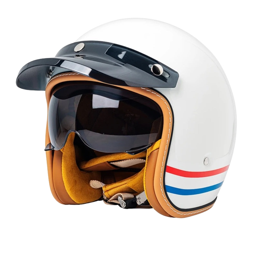 White motorcycle helmet with brown leather accents and a visor on a white background