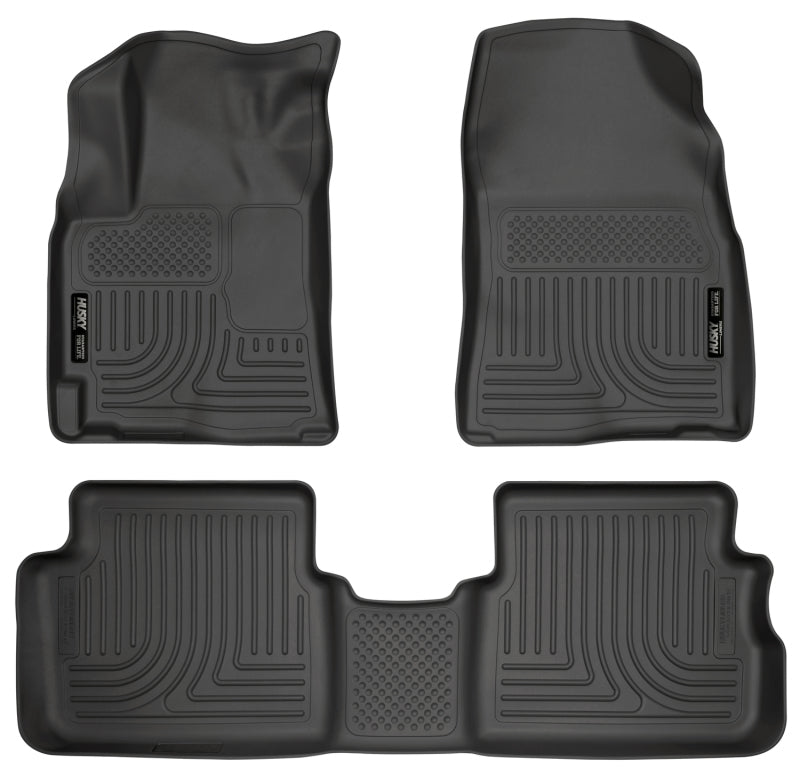 Set of four black car floor mats on a white background