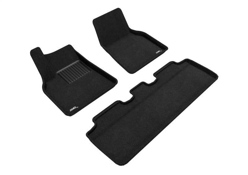 Set of black car floor mats on a white background