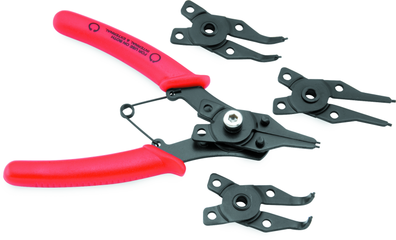 Pair of red-handled pliers with black metal components on a white background