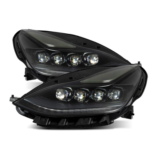 Pair of black car headlights on a white background