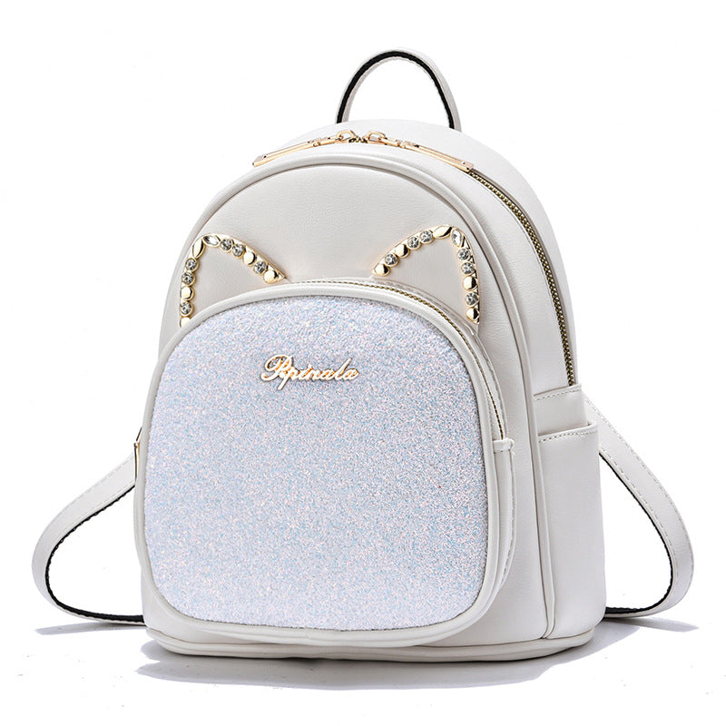 White backpack with glittery front panel and cat ear design on a white background