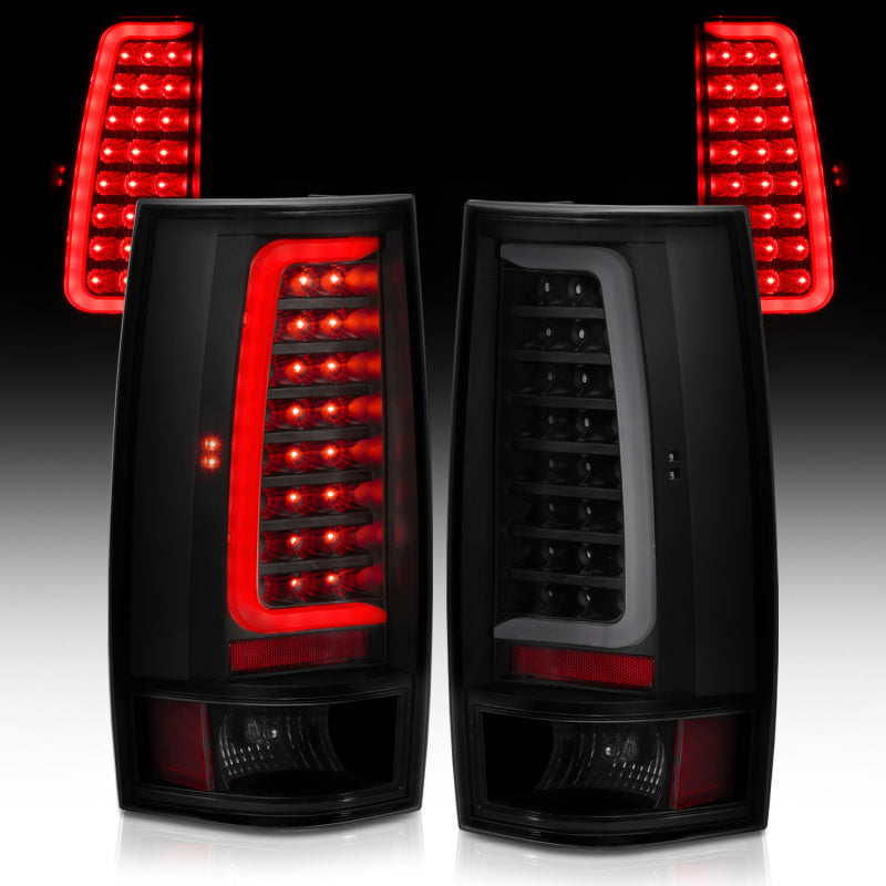 Pair of black Chevy Tahoe tail lights with red LED indicators on a dark background