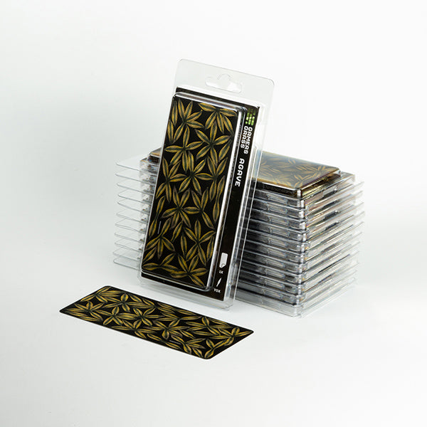 Packaged artificial Plants with gold geometric pattern on a white background