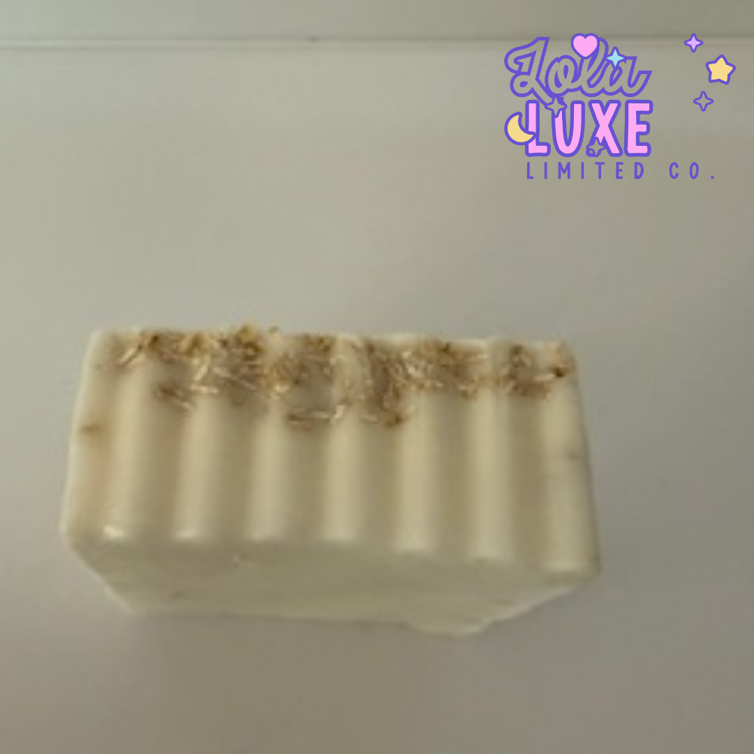 Bar of soap with gold accents on a plain background, featuring the 'Jola Luxe Limited Co.' logo.