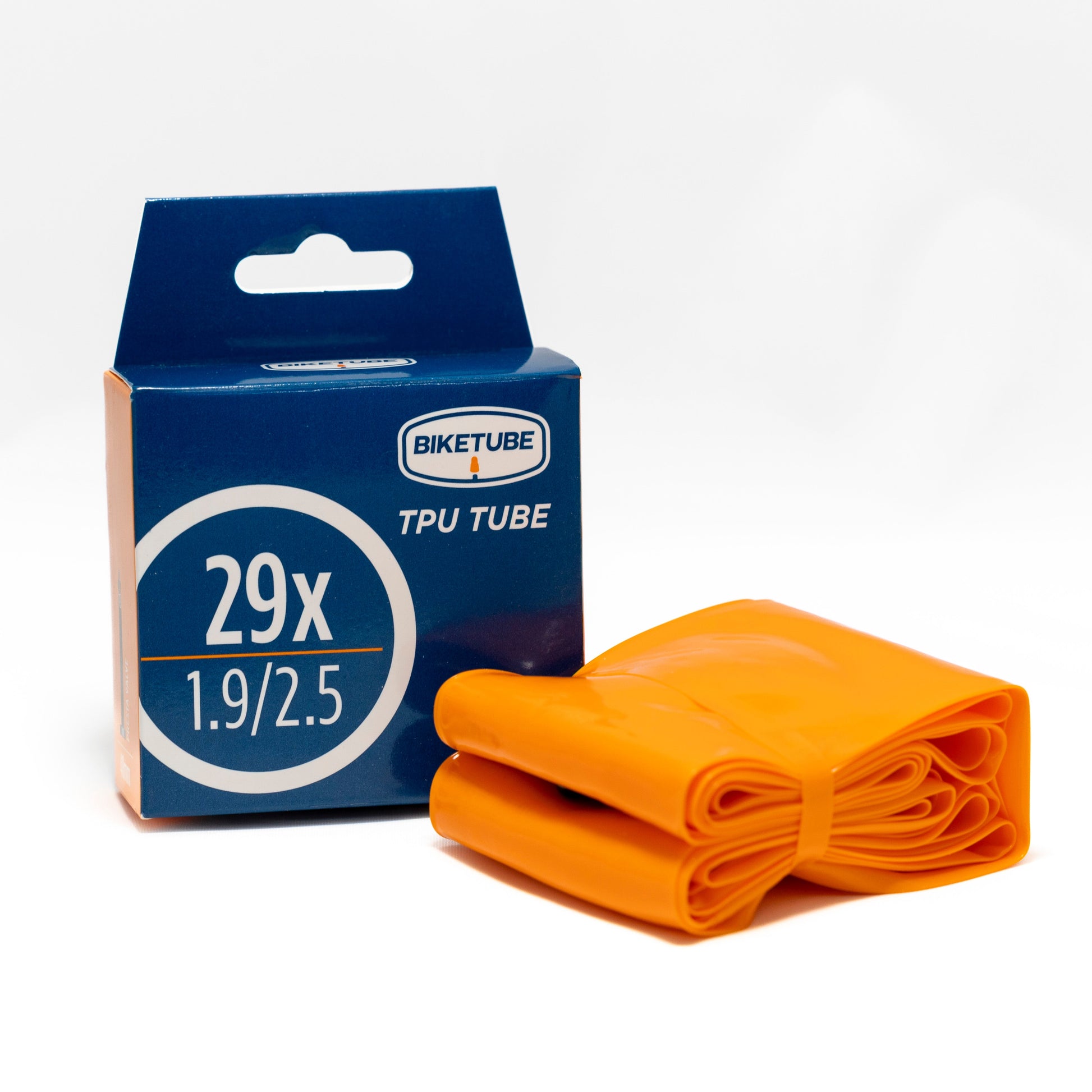 Orange bike tube with blue packaging on a white background