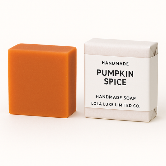 Pumpkin Spice handmade soap next to its packaging on a white background