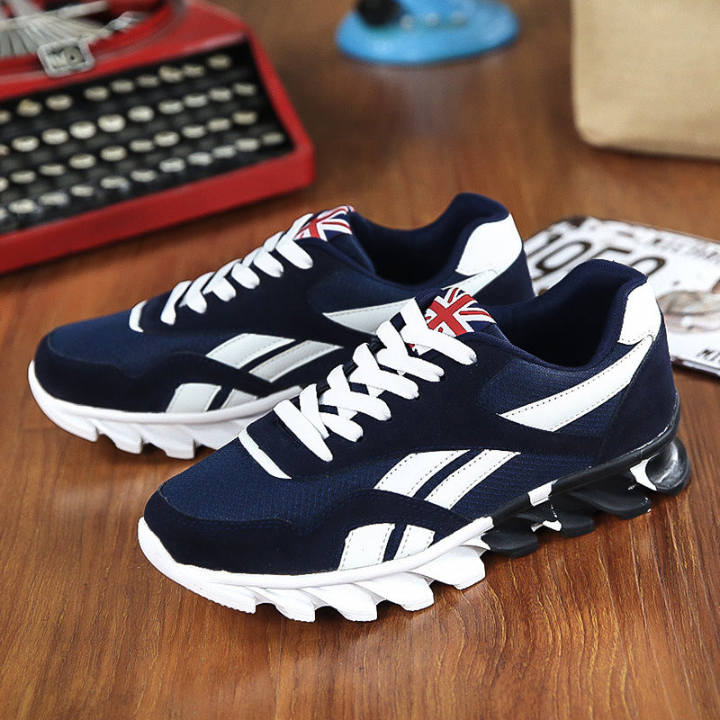 Navy and white sneakers with a British flag design on a wooden surface.