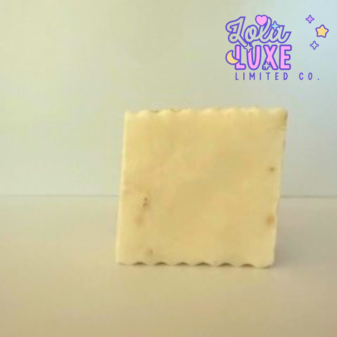 Square block of soap with 'Lotti Luxe Limited Co.' branding on a light background