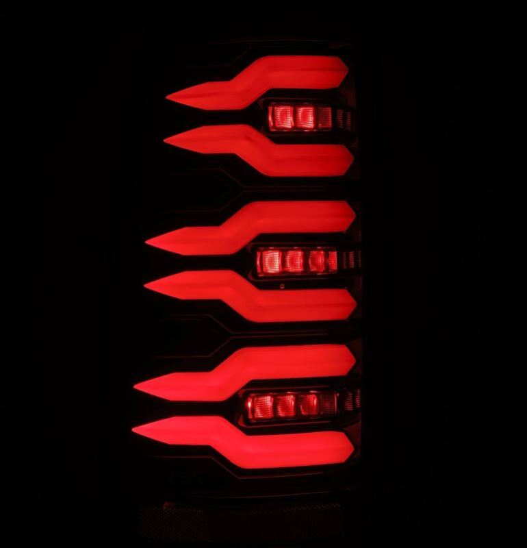 Red LED tail lights on a black background