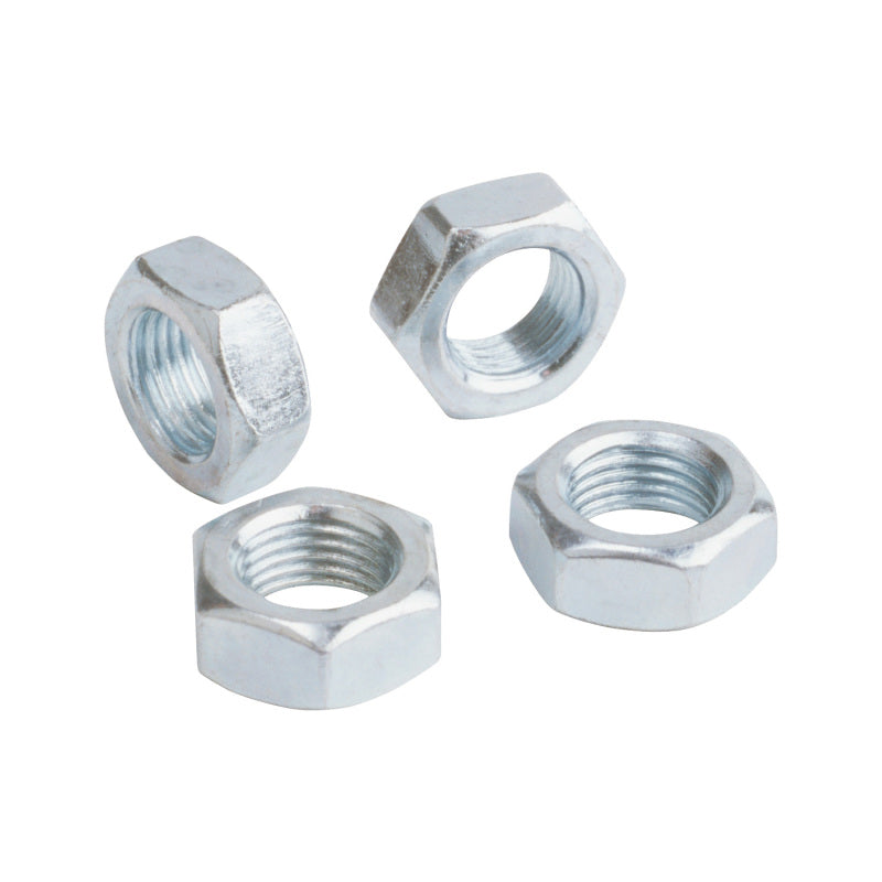 Four metal hex nuts on a white background