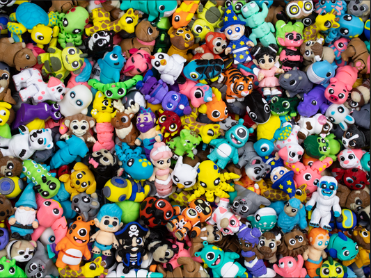 Collection of colorful small figurines in various shapes and colors.