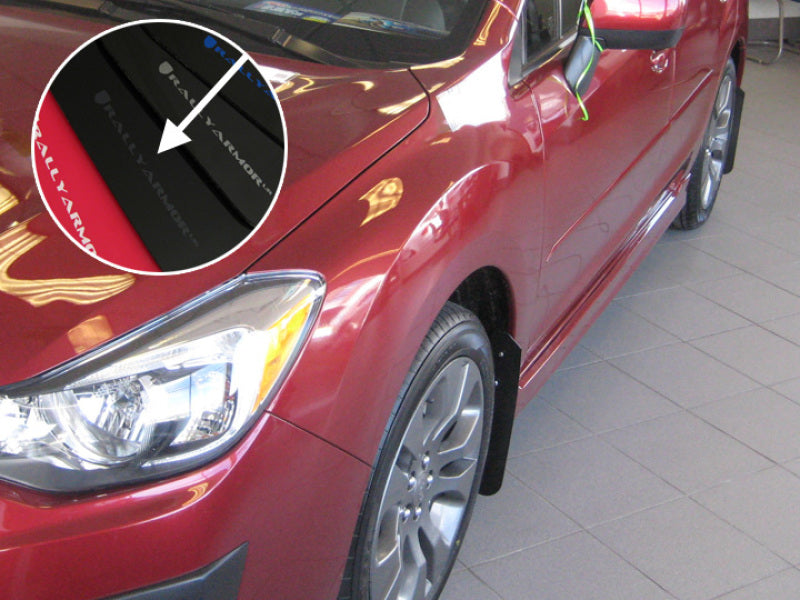 Red car with a close-up of a decal on the windshield