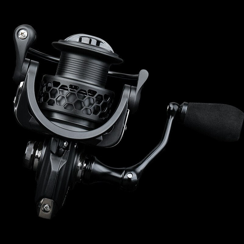 Black fishing reel on a black background