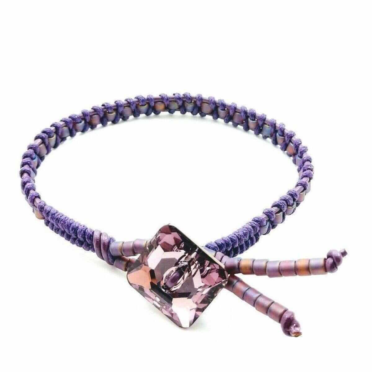 Amethyst Braided Leather Swarovski Crystal Square Button Bracelet. Purple beaded bracelet with a pink crystal clasp on a white background