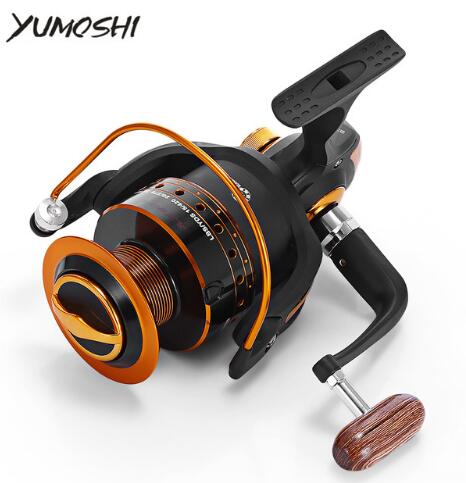 Fishing reel with orange and black design on a white background, featuring the YUMOSHI brand.