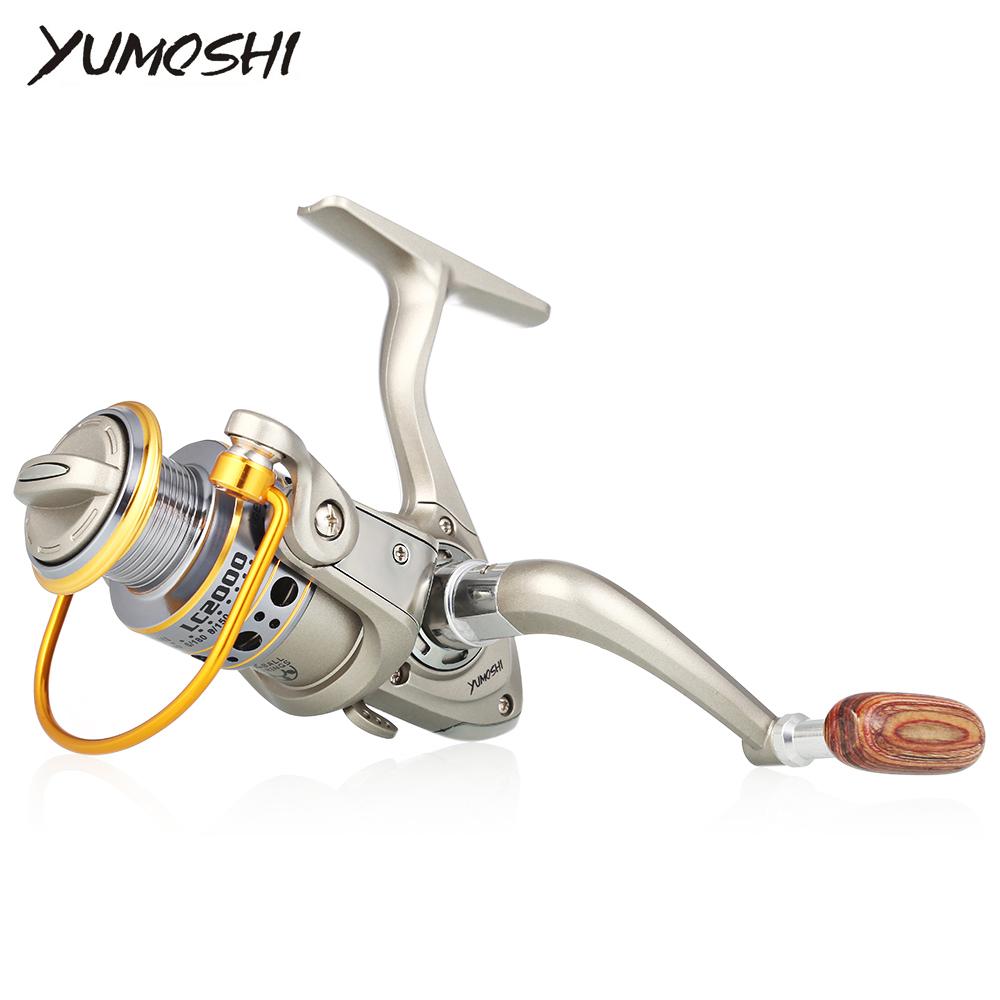 Fishing reel with 'YUMOSHI' branding on a white background