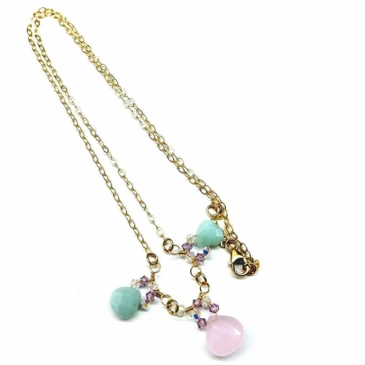 Necklace with gold chain and colorful beads on a white background