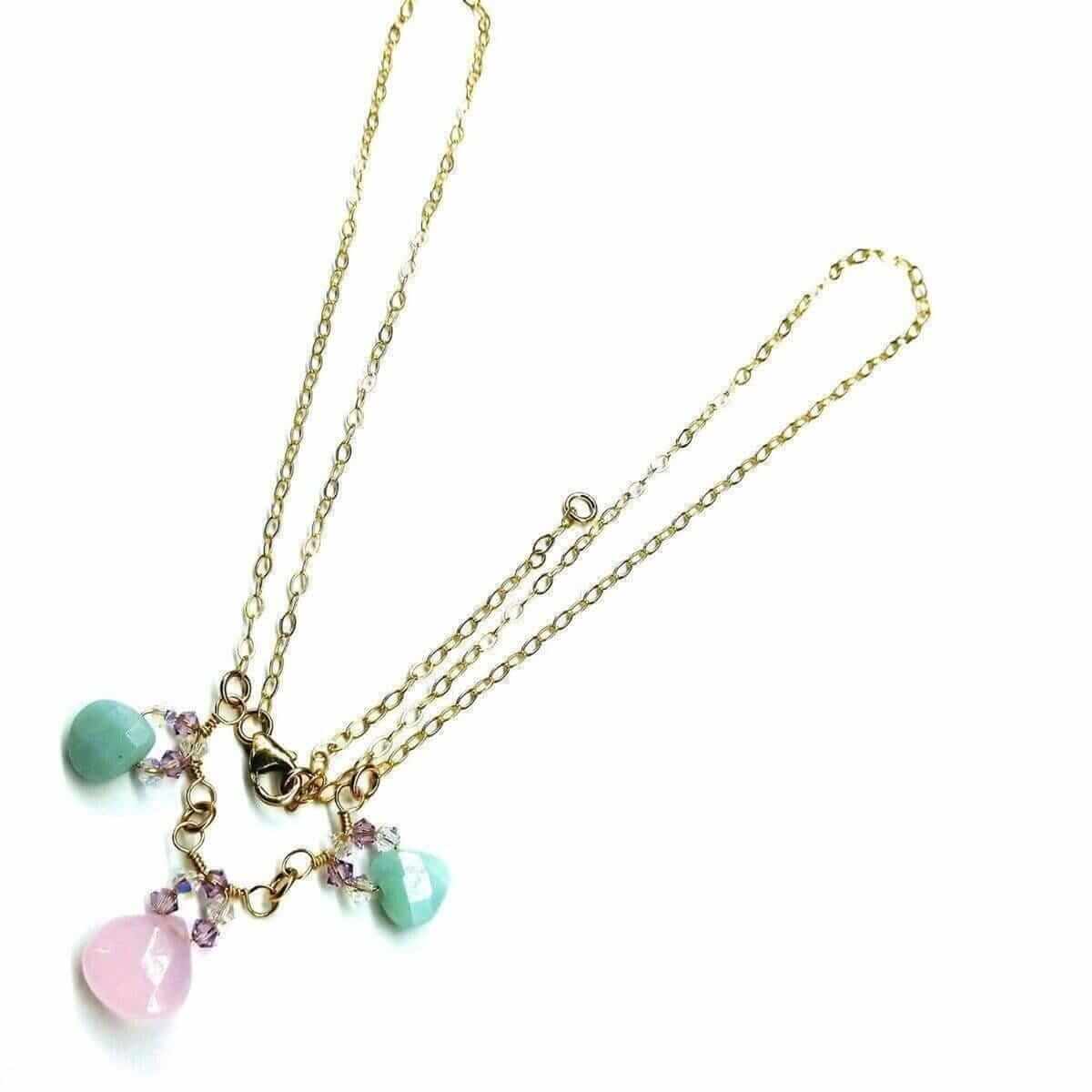 Necklace with pastel-colored charms on a white background
