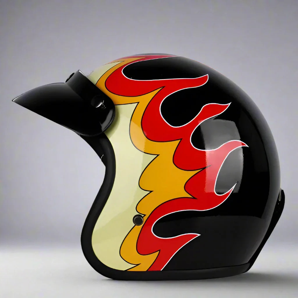 Black helmet with red and yellow flame design on a gray background